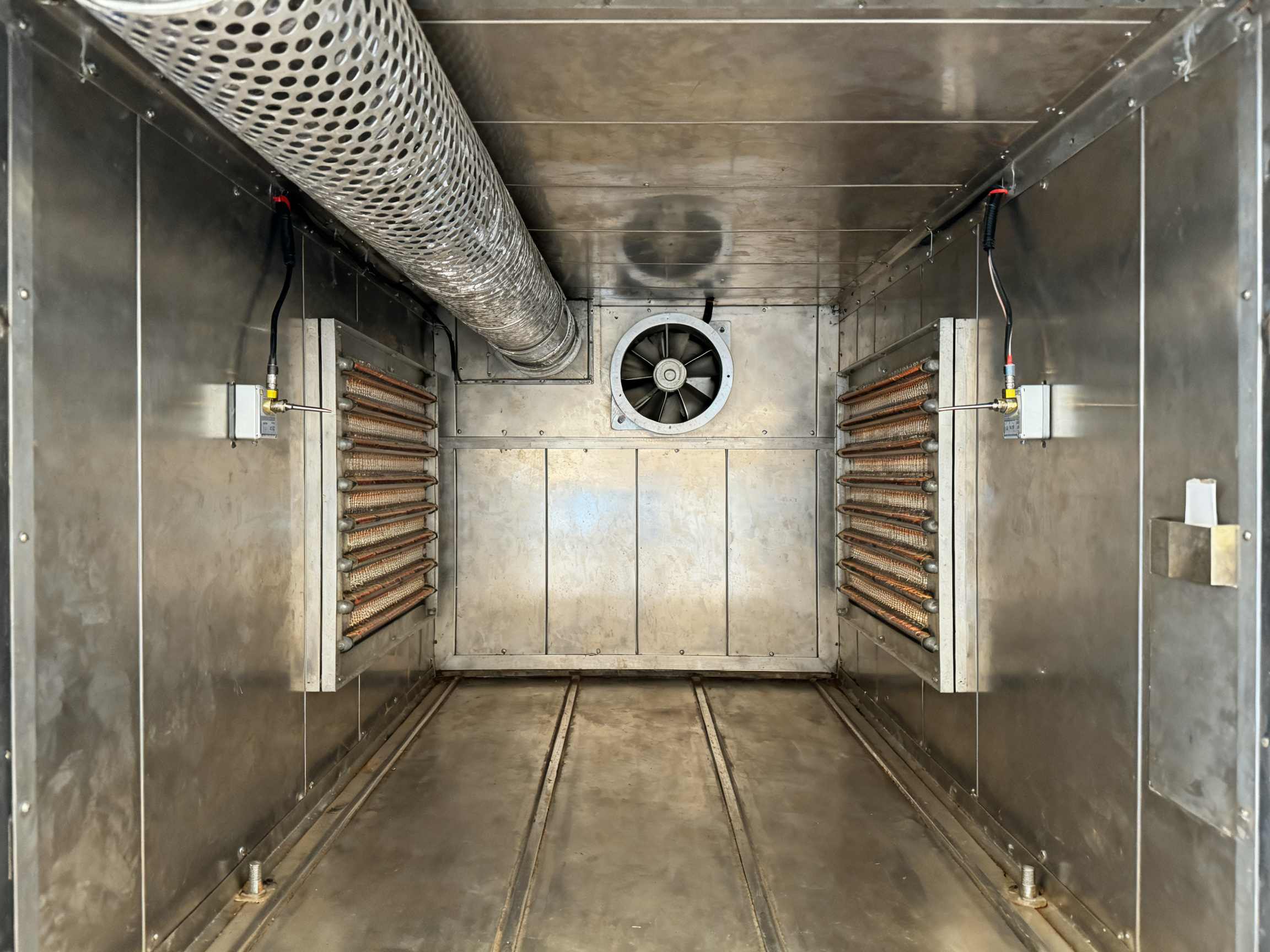 How a Vertical Curing Oven Is Made: Components, Heater Options, Controls, and Custom Configurations1 - S&M Co.Ltd Interior oven chamber view showing stainless steel panels and perforated supply duct.