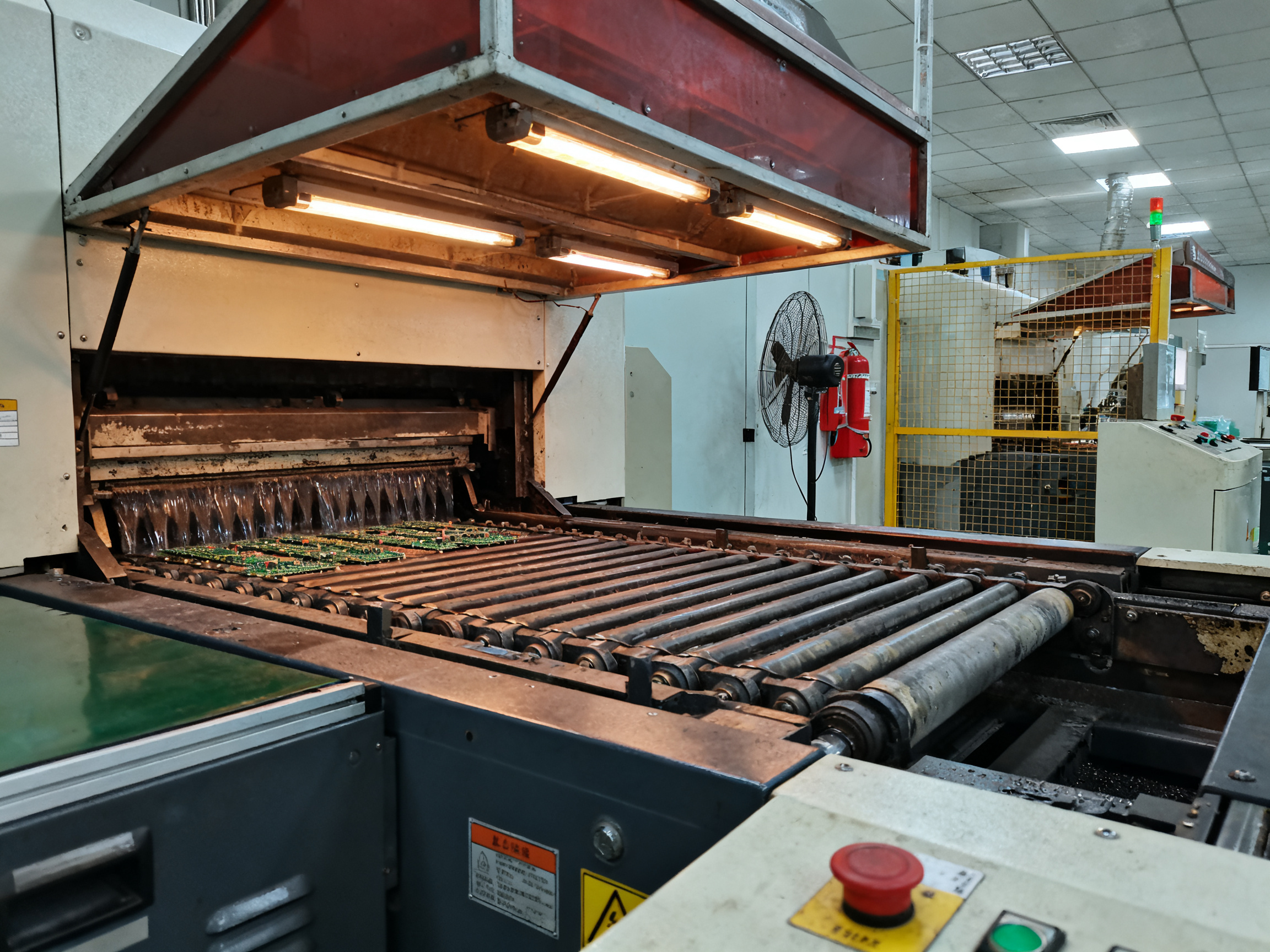 Best Wave Soldering Machine Prices by Region: 2026 Comprehensive Guide - S&M Co.Ltd Industrial documentary photograph of a wave soldering machine solder pot area showing solder flow mechanics and heating elements.
