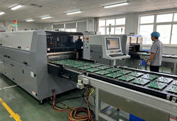 1789635815-electronics-assembly-factory-floor-wave-soldering-machine-in-mid-production-circ-1789635813781