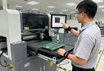1791601371-medium-shot-of-selective-wave-soldering-machine-operator-station-in-electronics-1791601369437