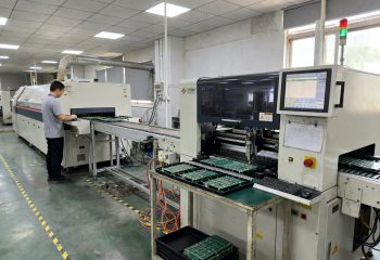 1792249293-eye-level-documentary-view-of-an-smt-production-line-with-paste-printer-pick-and-1792249290890