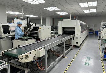 1792249300-smt-production-line-documentary-photograph-electronics-factory-floor-view-along-1792249294720