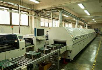1792700465-documentary-photograph-of-a-mid-size-electronics-assembly-line-in-an-ordinary-fa-1792700465216