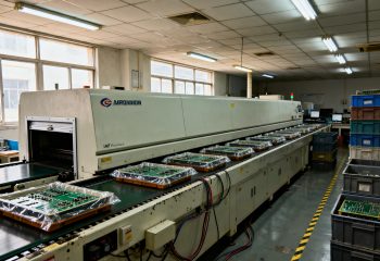 1792741021-wide-documentary-view-of-an-ordinary-smt-reflow-production-line-in-a-working-ele-1792741021147